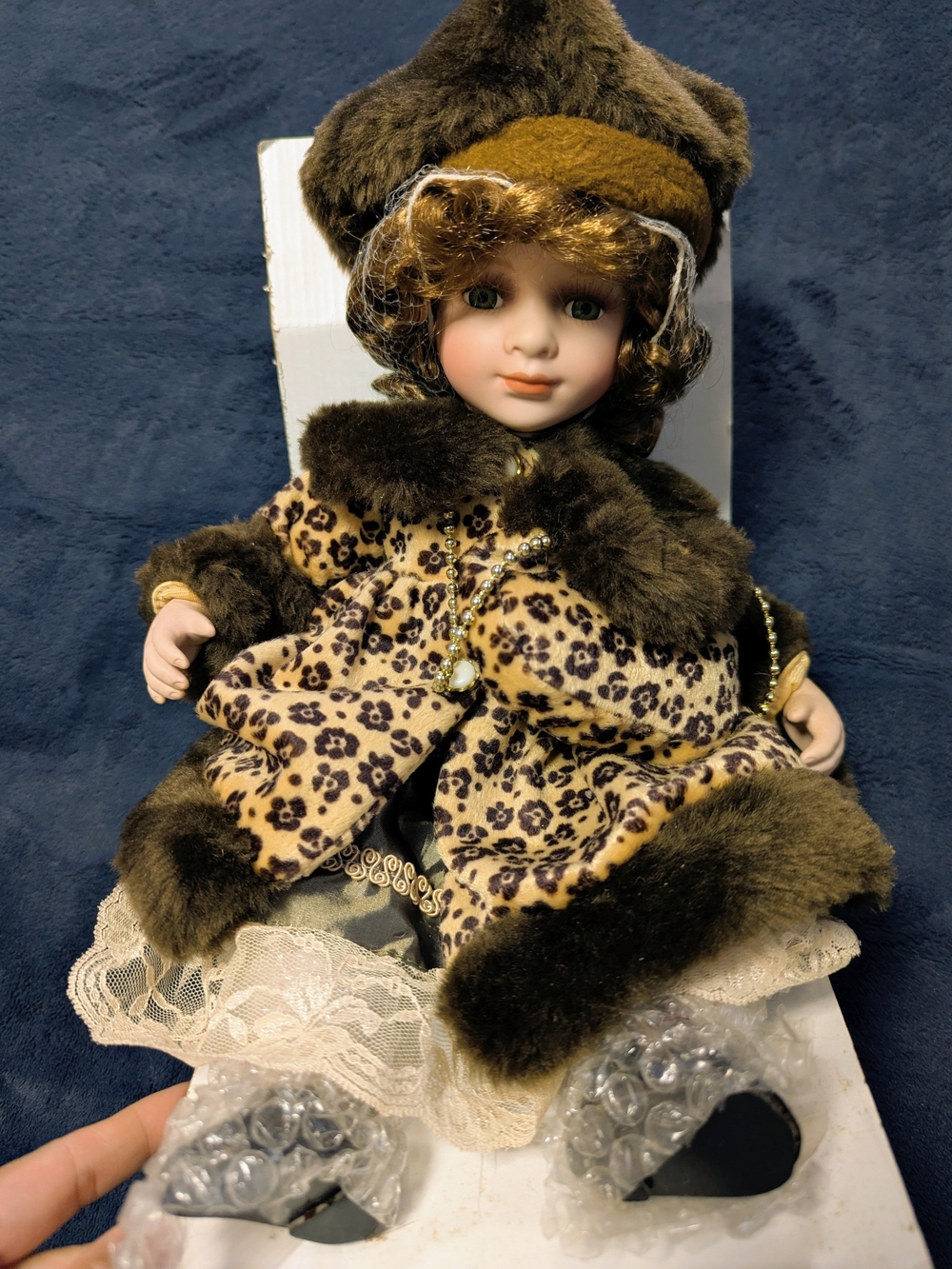 12" Sitting Porcelain Fashion Doll in Brown and Cream Leopard Outfit